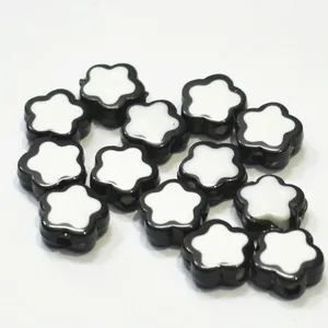 Close-up of black and white flower acrylic beads for DIY crafting jewelry