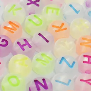 Macro detail of 7mm frosted colorful acrylic alphabet beads for DIY jewelry making