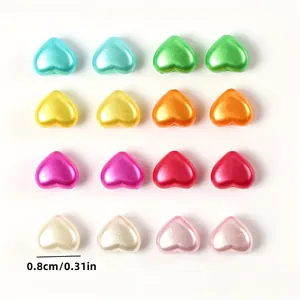 Macro view of 8mm heart-shaped faux pearl beads in multiple colors for DIY crafts