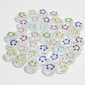 Detail view of 10mm clear acrylic beads with colorful smiley faces for DIY jewelry crafts.