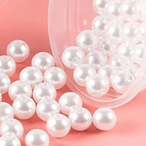 Detailed macro view of smooth white ABS imitation pearl beads with straight holes for crafts