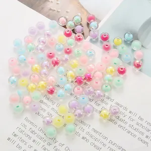 Macro detail of 8-10mm colorful acrylic double-layer beads for DIY jewelry making.