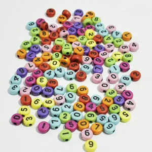 Macro view of colorful 7mm acrylic round beads with printed numbers 0 to 9