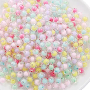 Detailed view of colorful 8-10mm bead-in-bead acrylic spheres for DIY jewelry crafting