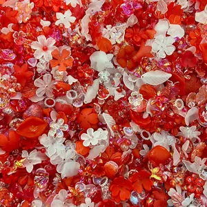 Macro view of mixed red and white acrylic flower beads for DIY crafts