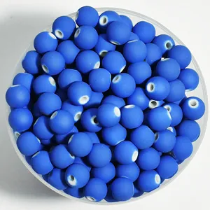 Detailed top-down view of 8mm matte blue spray-painted round beads for DIY
