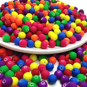 Detailed close-up of colorful matte acrylic beads with rubber finish for DIY jewelry crafting