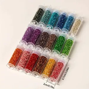 Detail view of 2mm colorful glass seed beads with tube dimensions 6.7cm by 2cm.