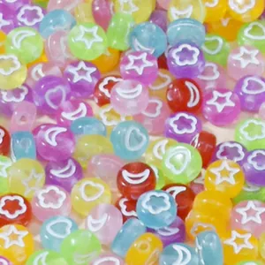 Close-up of 7mm colorful acrylic beads with star and moon patterns for DIY jewelry making