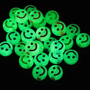 Detailed macro view of luminous green acrylic smiley face beads glowing in the dark.
