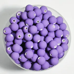 Top view detail of 8mm purple matte acrylic round beads with white center holes for DIY jewelry
