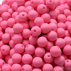 Close-up of pink acrylic beads with matte rubber paint finish for DIY jewelry making