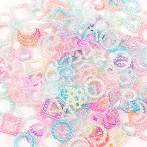 Macro detail of 10-11mm pastel gradient pearl beads in star moon and flower shapes