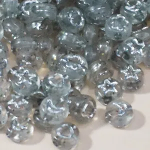 Detailed close-up of 7mm grey acrylic beads with star and moon patterns for DIY jewelry making