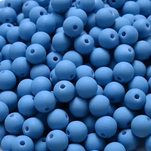 Close-up of matte blue acrylic beads with soft rubber paint finish for DIY jewelry