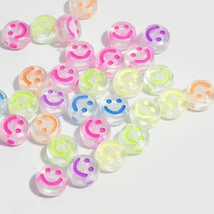 Vibrant 7mm translucent acrylic round beads featuring colorful smiley face for DIY crafts