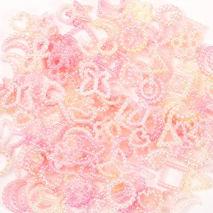 Detail view of 10-11mm pink gradient pearl charms in star, moon, and heart shapes