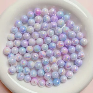 Close-up of iridescent AB-coated acrylic round beads in light purple and blue