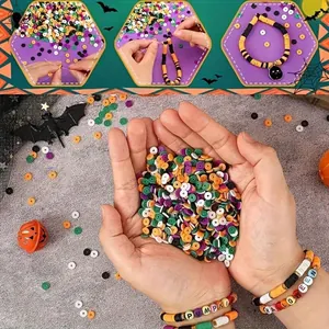 DIY Halloween polymer clay bead kit showing colorful beads and finished bracelets in hand.