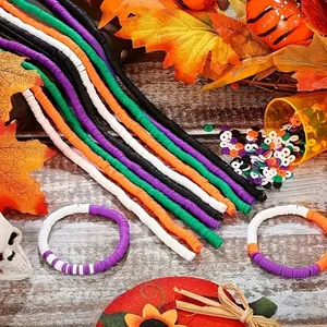 Close-up of colorful Halloween polymer clay heishi bead strands and handmade bracelets