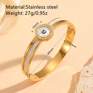 Elegant gold plated stainless steel evil eye bangle with white shell inlay and sparkling crystals