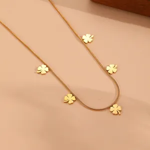 Close-up detail of a gold titanium steel snake chain necklace with five clover charms