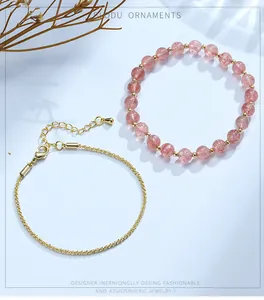 Detail of natural strawberry quartz beaded bracelet paired with a 14K gold filled chain