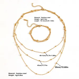 Detail showing multi-layer gold bead chain necklace set with size markings