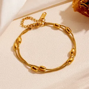 Elegant minimalist double-layered gold stainless steel anklet featuring polished oval beads