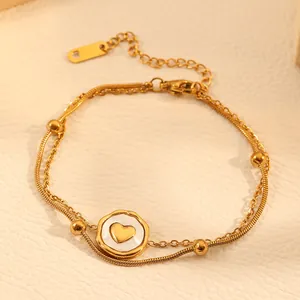 Detailed view of gold double-layer heart pendant anklet made of titanium steel