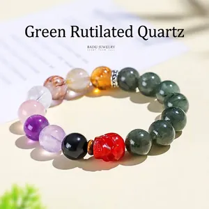 Natuurlijke groene rutilated kwarts armband 12mm met een opvallende rode schedel kraal