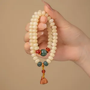 Handgefertigtes cremegelbes Bodhi-Wurzel Gebetsperlen Armband mit Lotus-Anhänger