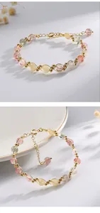 Detail showing multi-colored natural rutilated quartz crystal beads and woven gold-tone wire