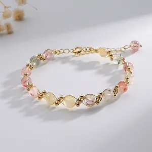 Natural multi-color rutilated quartz crystal bracelet with gold wire wrap design
