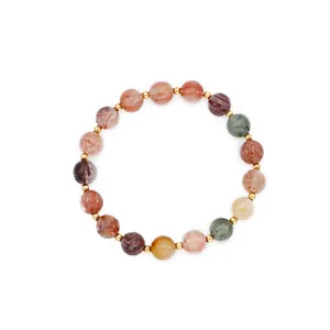 Natuurlijke veelkleurige rutielkwarts kralenarmband met gouden accenten