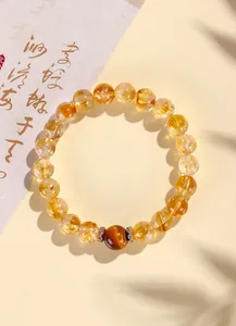 Bracelet en perles de citrine naturelle avec une pierre œil de tigre et cristaux