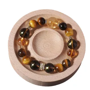 Bracelet perles en œil de tigre naturel et citrine pour femme sur support en bois