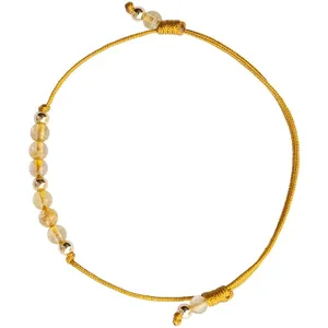 Handmade adjustable yellow cord bracelet featuring natural citrine stones and 14k gold beads