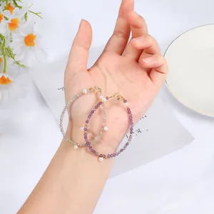 Natuurlijke amethist en grijze maansteen armband met zoetwaterparel bedeltjes