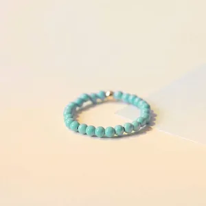 Minimalist 2mm turquoise bead ring with a 14k gold accent, retro style jewelry for women