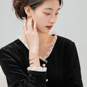 Elegant natural crystal gold plated bracelet worn by a model for a stylish lifestyle look.