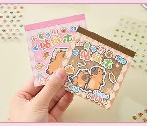 Close-up of cute Capybara sticker books with shiny holographic details