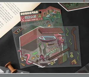 Detail view of pixel art horror sticker sheets and diorama card for DIY crafting.