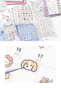 Detailed macro view of cute puppy cartoon sticker applied on a planner calendar page
