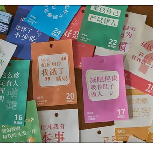Detailed view of 2026 tear-off calendar pages with colorful funny Chinese quotes