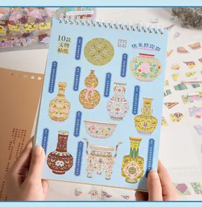 Detailed view of DIY sticker book featuring 10 unique vintage Qing porcelain designs