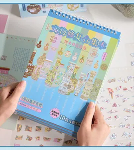 Hands holding a vintage DIY ancient porcelain restoration sticker book with clear details