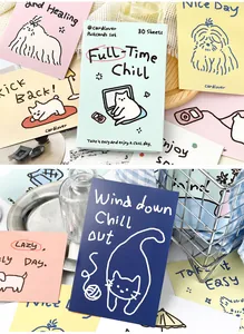 Close-up detail of Korean Ins style postcards with hand-drawn pets and chill text.