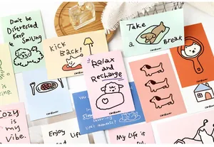 Detail view of Cardlover pet postcards featuring motivational English handwriting