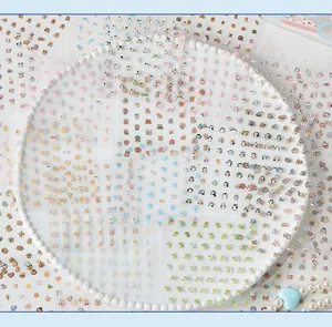 Macro view of mini PET stickers featuring cute animal and alphabet patterns for DIY decor